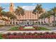 Exterior of a historic hotel with palm trees, manicured gardens, and a grand entrance at 400 Beach Ne Dr # 1202, St Petersburg, FL 33701