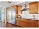 Bright kitchen with stainless steel refrigerator, custom cabinets, and marble backsplash at 400 Beach Ne Dr # 1202, St Petersburg, FL 33701