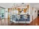 Kitchen features a breakfast bar, stainless steel appliances, and wood floors at 400 Beach Ne Dr # 1202, St Petersburg, FL 33701