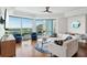 Bright living room with floor-to-ceiling windows and modern furnishings overlooking the city and ocean at 400 Beach Ne Dr # 1202, St Petersburg, FL 33701