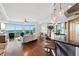 Bright living room with hardwood floors, open floor plan, bar seating, and beautiful views at 400 Beach Ne Dr # 1202, St Petersburg, FL 33701
