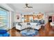 Open concept living room features hardwood floors, kitchen access, and city views at 400 Beach Ne Dr # 1202, St Petersburg, FL 33701