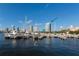 Condominium view from the marina, with boats docked in the foreground and city skyline in the background at 400 Beach Ne Dr # 1202, St Petersburg, FL 33701