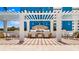 Outdoor kitchen with a built-in barbecue and seating area for outdoor gatherings at 400 Beach Ne Dr # 1202, St Petersburg, FL 33701