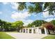 Picturesque park arbor structure covered in vines and flowers with a blue sky at 400 Beach Ne Dr # 1202, St Petersburg, FL 33701