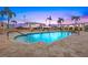 Beautiful pool with palm trees and inviting seating area, perfect for relaxation and recreation at 400 Beach Ne Dr # 1202, St Petersburg, FL 33701