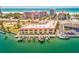 Coastal building with boat docks and parking next to the ocean at 4103 Gulf Blvd # 205, St Pete Beach, FL 33706