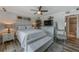 Comfortable main bedroom with stylish decor, ceiling fan, and serene ambiance at 4103 Gulf Blvd # 205, St Pete Beach, FL 33706