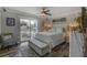 Inviting main bedroom boasts sliding glass door, balcony access, and plenty of natural light at 4103 Gulf Blvd # 205, St Pete Beach, FL 33706