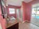 Bright bathroom featuring dual sinks, tile floors, a tub, and access to the pool at 4301 50Th S Ter, St Petersburg, FL 33711
