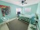 Cozy bedroom with a ceiling fan, carpet, and a vibrant color scheme at 4301 50Th S Ter, St Petersburg, FL 33711