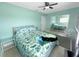Inviting bedroom with a ceiling fan, mirrored closet, and ample natural light at 4301 50Th S Ter, St Petersburg, FL 33711