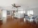 Spacious dining area with a ceiling fan and views into the living room and kitchen at 4301 50Th S Ter, St Petersburg, FL 33711