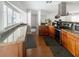 Well-lit kitchen featuring granite countertops, stainless steel appliances, and dark wood cabinetry at 4301 50Th S Ter, St Petersburg, FL 33711