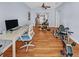 Large living room with hardwood floors, overlooking pool, and a ceiling fan at 4301 50Th S Ter, St Petersburg, FL 33711