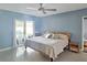 Serene main bedroom featuring a ceiling fan, a private entrance to the pool, and neutral tones at 4301 50Th S Ter, St Petersburg, FL 33711