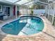 Inviting in-ground pool is surrounded by brick pavers and screened-in for year-round enjoyment at 4301 50Th S Ter, St Petersburg, FL 33711