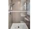 Beautiful tiled shower with a built-in seat and modern showerhead at 4301 50Th S Ter, St Petersburg, FL 33711