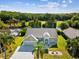 Aerial view of a beautiful home with lush greenery and access to a serene waterway at 4320 Northampton Dr, New Port Richey, FL 34653