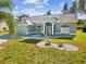 Charming single-story home with a well-manicured lawn and decorative stone landscaping in the front yard at 4320 Northampton Dr, New Port Richey, FL 34653
