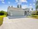 Inviting single-Gathering home with a spacious driveway, two-car garage, and landscaped front yard at 4320 Northampton Dr, New Port Richey, FL 34653