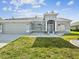 Charming single-story home featuring a well-manicured lawn and arched windows at 4320 Northampton Dr, New Port Richey, FL 34653