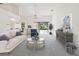 Sunlit living room with high ceilings, neutral paint, plush carpeting and serene views at 4320 Northampton Dr, New Port Richey, FL 34653