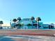 The historic Gulfport Casino exterior with palm trees and the waterfront in the background at 5148 Newton S Ave, Gulfport, FL 33707