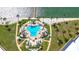 Aerial view of the community pool featuring palm trees and lounge chairs at 5220 Brittany S Dr # 807, St Petersburg, FL 33715