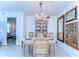 Bright dining area with chandelier lighting, a stylish table set, and charming décor, perfect for gatherings at 5220 Brittany S Dr # 807, St Petersburg, FL 33715