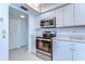Efficient kitchen features stainless steel appliances, ample counter space, and white cabinetry for a sleek design at 5220 Brittany S Dr # 807, St Petersburg, FL 33715