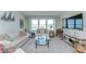 Bright living room with comfortable seating, large windows, and stylish decor; great for relaxing and entertaining at 5220 Brittany S Dr # 807, St Petersburg, FL 33715