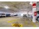 Well-lit parking garage with designated parking spots at 5220 Brittany S Dr # 807, St Petersburg, FL 33715