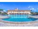 Resort-style pool with lounge chairs and a building in the background at 5220 Brittany S Dr # 807, St Petersburg, FL 33715