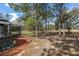 Scenic backyard featuring a patio, fire pit, and mature trees, creating a serene outdoor environment at 5225 Eagle Blvd, Land O Lakes, FL 34639