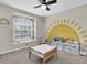 room featuring a bright painted mural and a large window with a window seat at 5225 Eagle Blvd, Land O Lakes, FL 34639