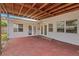 Covered back patio with wood beams and access doors at 5813 18Th S Ave, Gulfport, FL 33707