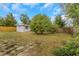 View of the backyard showing the storage shed and the fenced perimeter at 5813 18Th S Ave, Gulfport, FL 33707