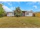 Spacious backyard featuring a covered patio and lush landscaping, perfect for outdoor enjoyment at 5813 18Th S Ave, Gulfport, FL 33707