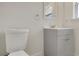 Bright bathroom featuring a sleek vanity, updated fixtures, and a modern toilet at 5813 18Th S Ave, Gulfport, FL 33707