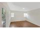 A bright bedroom with laminate flooring and two windows at 5813 18Th S Ave, Gulfport, FL 33707