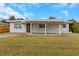 Charming single-story home featuring an open front carport and a well-maintained front lawn at 5813 18Th S Ave, Gulfport, FL 33707