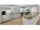 Modern kitchen features stainless steel appliances, granite counters, and white cabinetry at 5813 18Th S Ave, Gulfport, FL 33707