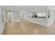 Open-concept living room featuring tile floors, connecting to the kitchen area at 5813 18Th S Ave, Gulfport, FL 33707