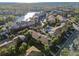 An aerial view shows the community's appealing pool area, mature landscaping, and ample parking at 6330 Newtown Cir # 30B4, Tampa, FL 33615