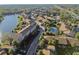 An aerial view shows the property's proximity to a river and ample parking, plus a view of the community pool at 6330 Newtown Cir # 30B4, Tampa, FL 33615