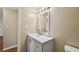 Bathroom featuring a vanity with sink, mirror, and tiled walls at 6330 Newtown Cir # 30B4, Tampa, FL 33615