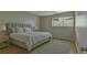 Cozy bedroom with a large bed, bedside tables, and a soft rug at 6330 Newtown Cir # 30B4, Tampa, FL 33615