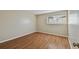 Neutral bedroom with wood floors and a bright window at 6330 Newtown Cir # 30B4, Tampa, FL 33615