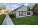 Exterior angle of building with green grass and walkway at 6330 Newtown Cir # 30B4, Tampa, FL 33615